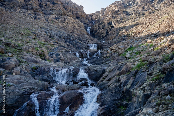 Fototapeta Cascade stone waterfall in a rock gorge