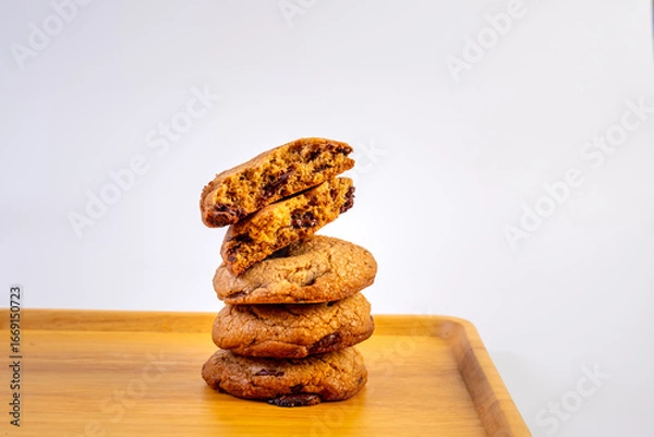 Fototapeta Stack of Dark Chocolate cookies isolated, American biscuits, cocoa confectionery cake, sweet morsels bakery, round pastry on white background
