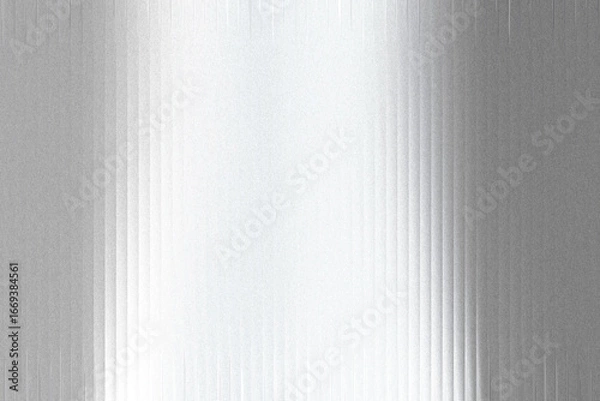 Fototapeta A textured metallic surface with a gradient of light and shadow, featuring vertical lines and a grainy, frosted appearance