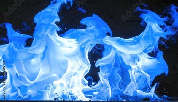 Obraz Abstract blue flames dance in swirling patterns against a dark background