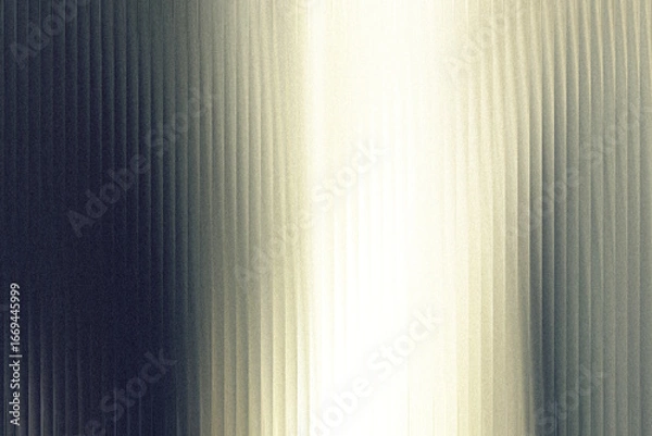 Fototapeta A gradient of light and shadow plays across a textured surface with vertical lines, creating a dramatic and abstract visual effect