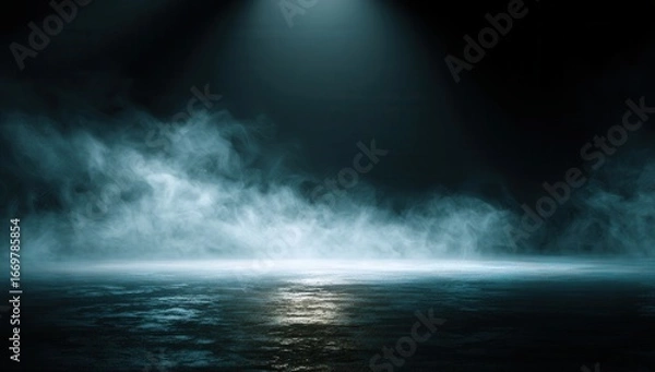 Fototapeta Mysterious blue spotlight illuminates swirling fog over dark rippling water creating an atmospheric and dramatic scene