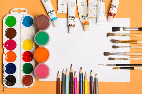 Fototapeta Paints brushes pencils paper colors mock up