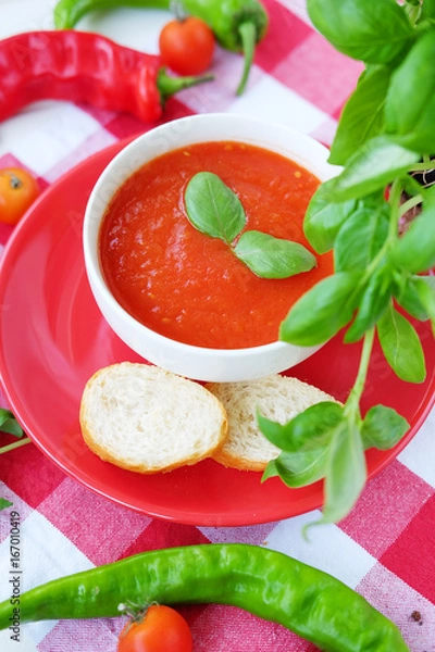 Fototapeta Cold summer tomato dish. Gaspacho soup with toast.