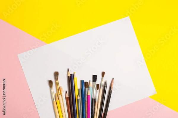 Fototapeta Paints brushes pencils paper colors mock up