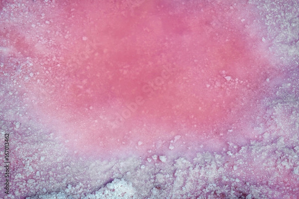 Fototapeta Pink brine and salt of Sivash Lake, colored by microalgae Dunaliella salina, famous for its antioxidant properties, enriching water by beta-carotene, used in medicine, dermatology  and  spa 