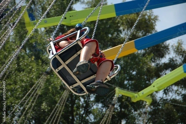 Obraz Boy riding on swing ride