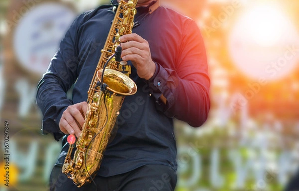 Fototapeta International jazz day and World Jazz festival. Saxophone, music instrument played by saxophonist player musician in fest.