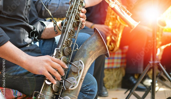 Fototapeta International jazz day and World Jazz festival. Saxophone, music instrument played by saxophonist player musician in fest.