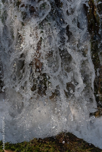 Fototapeta High-Speed Waterfall: Cascading onto Grass Blades