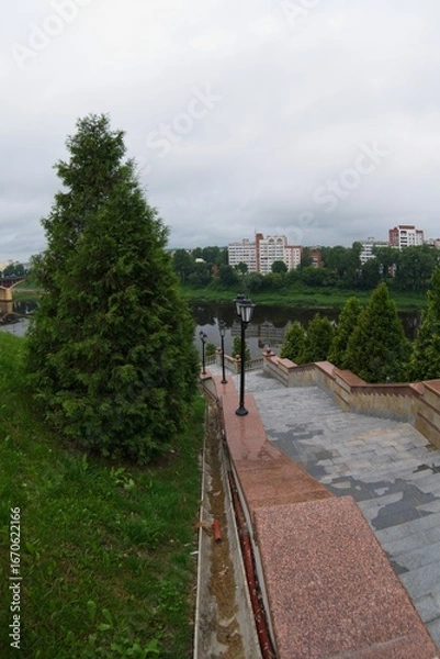 Fototapeta  Vitebsk, Belarus, July 19, 2025. Lanterns on the stairs to the river.                              