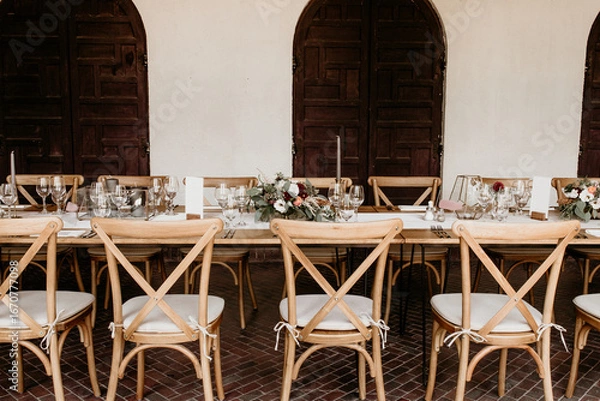 Fototapeta Rustic Wedding Reception Table with Floral Centrepieces