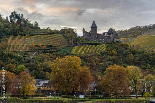 Fototapeta Photograph of a village while cruising along the Rhine River in Germany in the fall with a beautiful sky and fall colors
