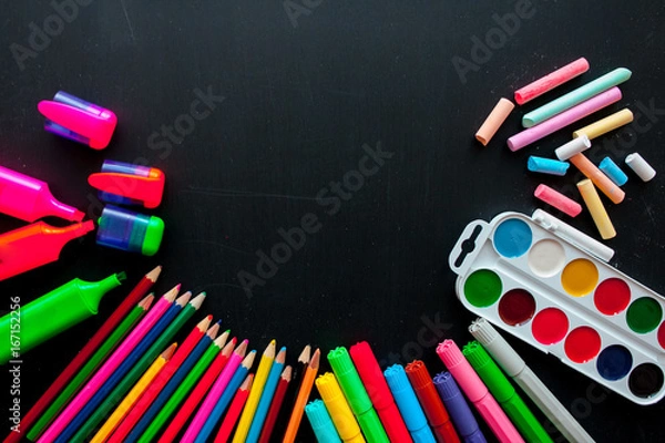 Fototapeta Back to school concept.School and office supplies on black background. Flat lay with copy space