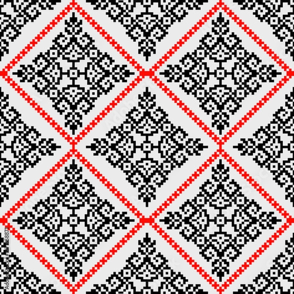 Obraz black and white seamless pattern
The symmetrical layout and handcrafted pixel texture evoke traditional folk embroidery and ethnic textile aesthetics, making it ideal for use in fabric prints, wallpap