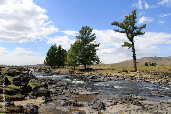 Fototapeta The Orkhon Waterfall is located in Mongolia. A small lake has formed where the waterfall, the source of the Orkhon River, flows into the water.