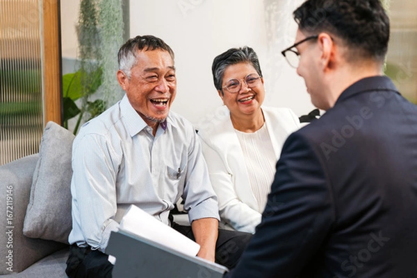 Fototapeta Cheerful senior couple meets financial advisor in modern office, discussing retirement planning, investment options, and insurance. Consultation helps clients manage finance with expert guidance.