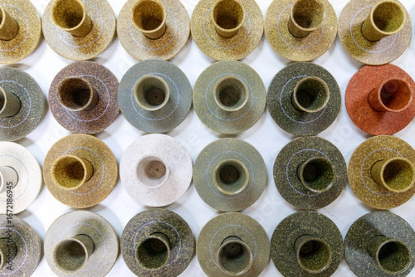 Fototapeta Eco-Friendly Cups and Saucers Made from Natural Materials on a White Table