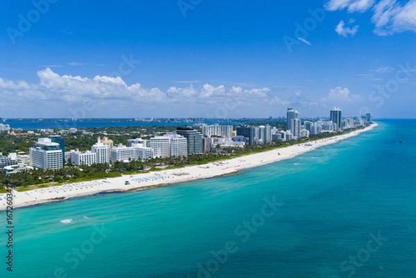 Fototapeta Aerial view of Miami beach coastline. Skyline and skyscrapers at Miami Beach. Summer Miamis vibes. Panoramic cityscape of Miami Beach. Miami skyline at daylight.