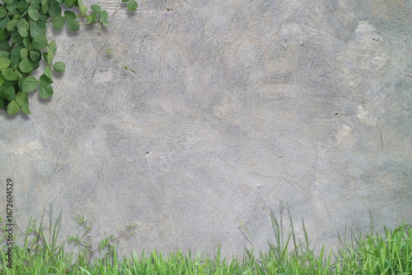 Fototapeta Textured gray wall with greenery in corners. Suitable for naturethemed designs, outdoor concepts, environmentrelated content, ecofriendly campaigns.