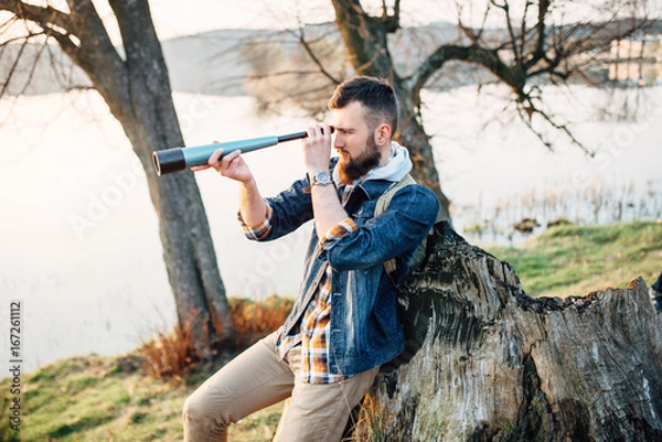 Obraz A guy with a telescope for nature...