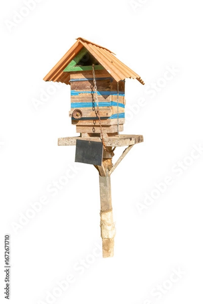 Fototapeta Photograph of a handmade wooden hive box for native bees. Sunny day. Concept of biodiversity preservation and ecology. Essential pollinators.