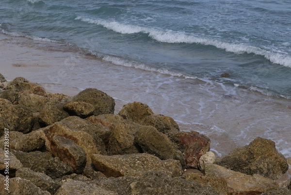 Fototapeta surface texture of large wave breaker rocks