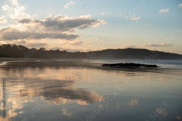 Fototapeta Sunset over Delicate Nobby Beach
