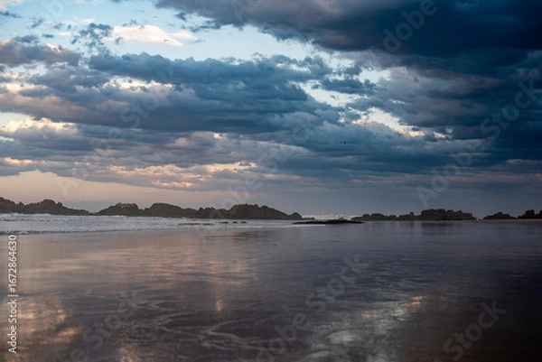 Fototapeta Sunset over Delicate Nobby Beach