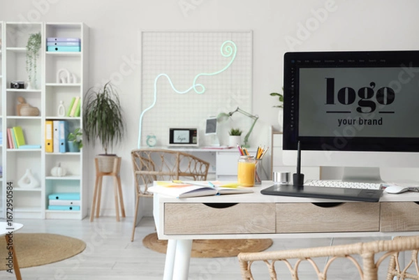 Fototapeta Graphic designer's workplace with computer and tablet in office