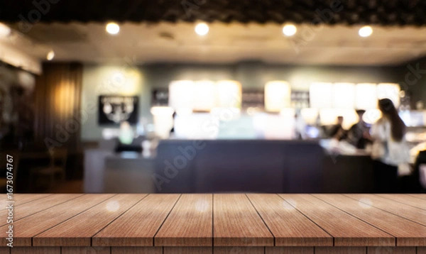 Fototapeta Empty wooden table top with lights bokeh on blur restaurant background.