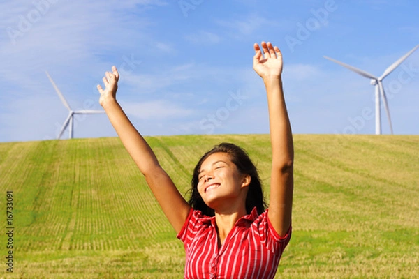Fototapeta Wind turbines and happy woman