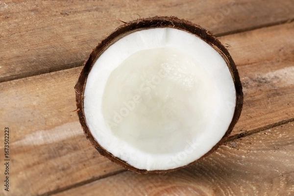 Obraz Fresh cracked or cut coconut on desk