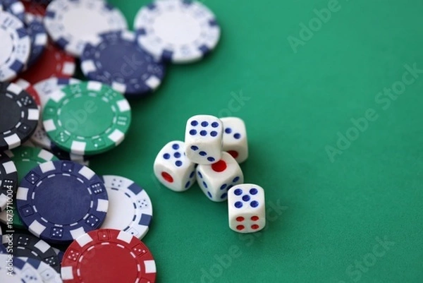 Fototapeta Dice game on the poker table in the casino. A successful combination of dice brought a lot of winning chips