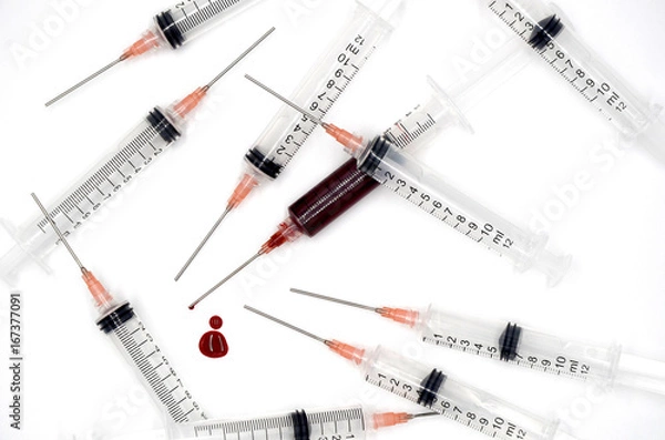 Fototapeta Syringe with blood on a white background photo