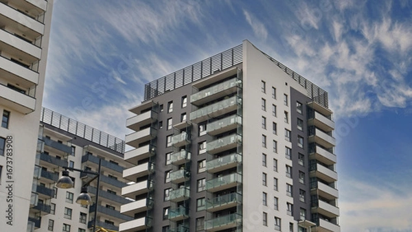 Obraz Exterior of ​​modern houses in new area of the city. Architectural detail of windows, balconies. Real estate, residential apartment and office building architecture