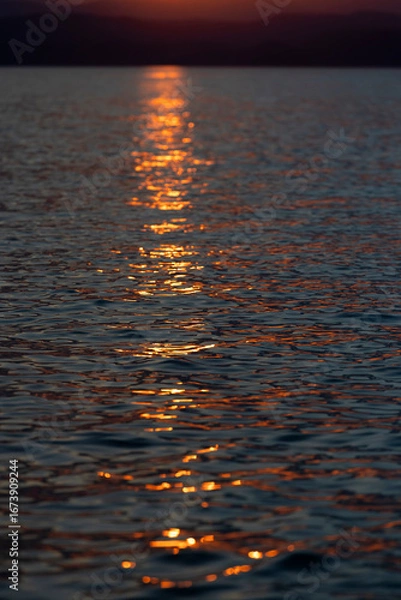 Fototapeta Sunset Reflections on Tranquil Waters at Dusk
