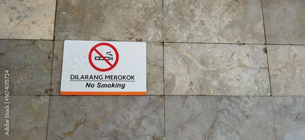 Fototapeta No smoking sign. A non-smoking area on a stone wall. The area is not for smoking.