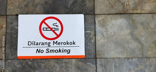 Fototapeta No smoking sign. A non-smoking area on a stone wall. The area is not for smoking.