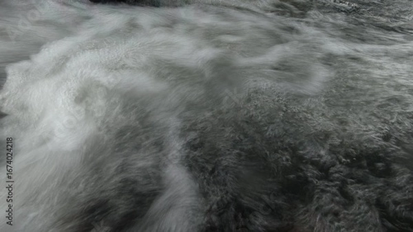 Fototapeta Scenic river with flowing water, rocks, trees, underwater view and sun reflection