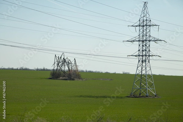 Obraz High-voltage transmission power tower with damaged structure