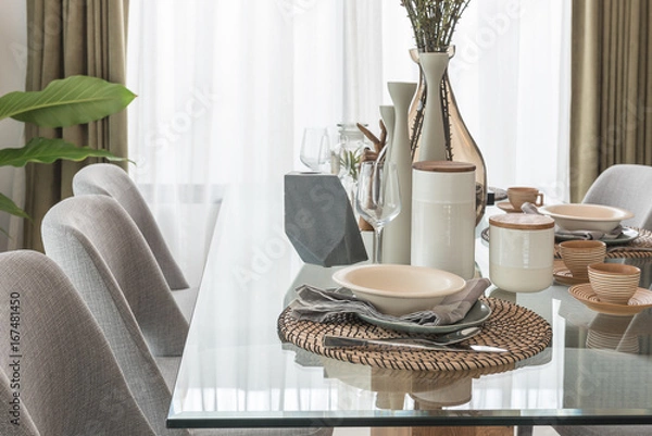 Fototapeta table set on glass dining table in modern dining room