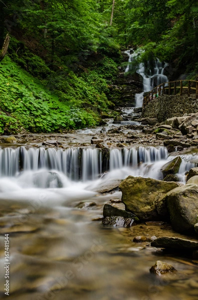 Fototapeta Landscape of waterfall Shypit in the Ukrainian Carpathian Mountains on the long exposure