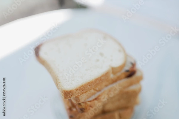 Fototapeta blurred White bread that is covered in flies makes the bread unhealthy