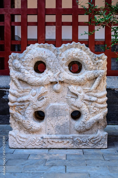 Obraz A stone tablet carved with Chinese dragon patterns
