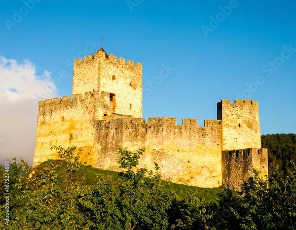 Obraz Majestic Medieval Castle on a Hilltop Under a Clear Blue Sky, Sunny Day