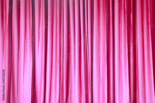 Fototapeta Red closed curtain with light spots in a theater