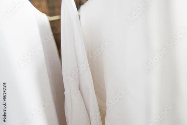 Obraz Washed white clothes on a hanger.