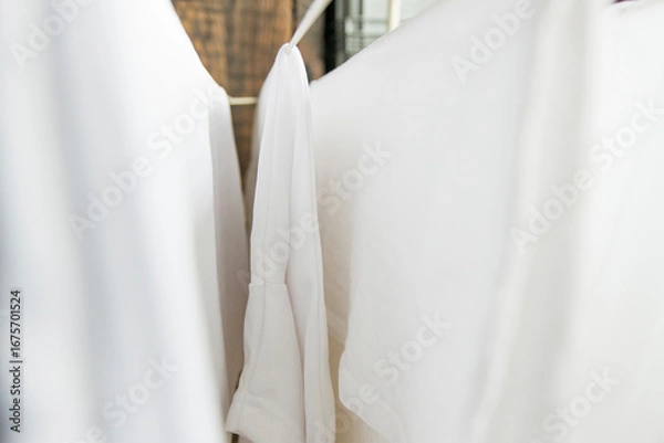 Obraz Washed white clothes on a hanger.