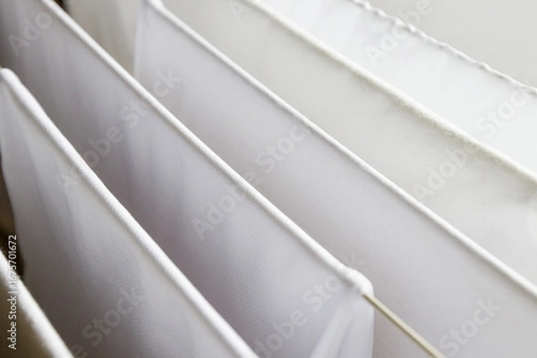 Obraz Washed white clothes on a hanger.